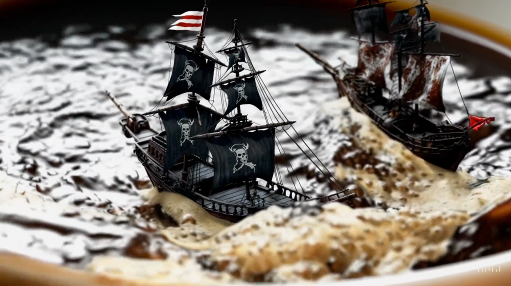 A still from a video generated by OpenAI's Sora, showing two pirate ships in coffee.